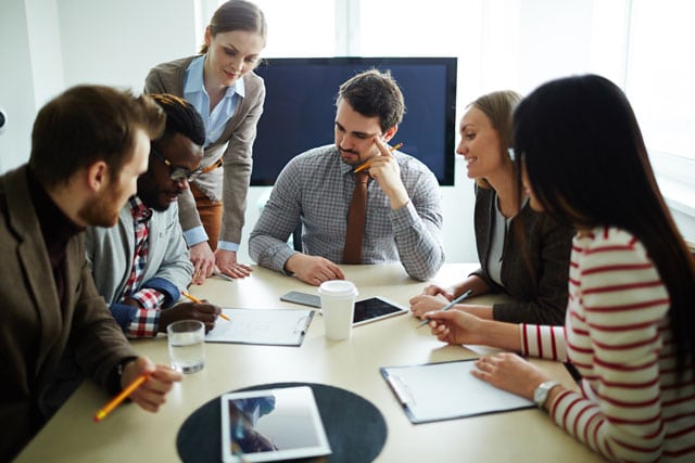 Some of our ERP consultants doing their work for a client
