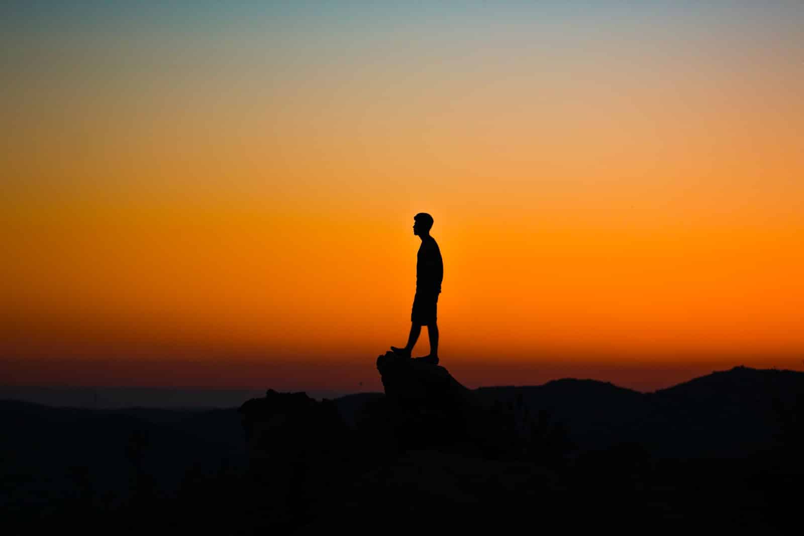 silhouette of man during sunset