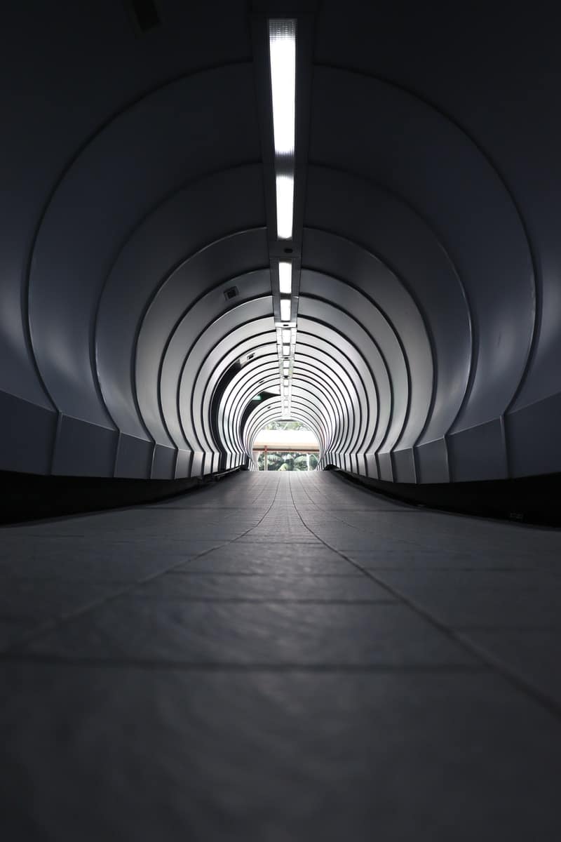 gray tunnel with white light